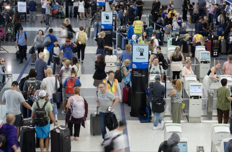 Flight cancellations ease after IT outage but disruptions continue