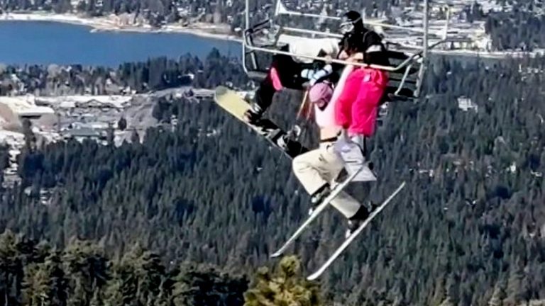 Skier’s prank backfires, leaving her dangling 65 feet in the air as twin desperately holds on